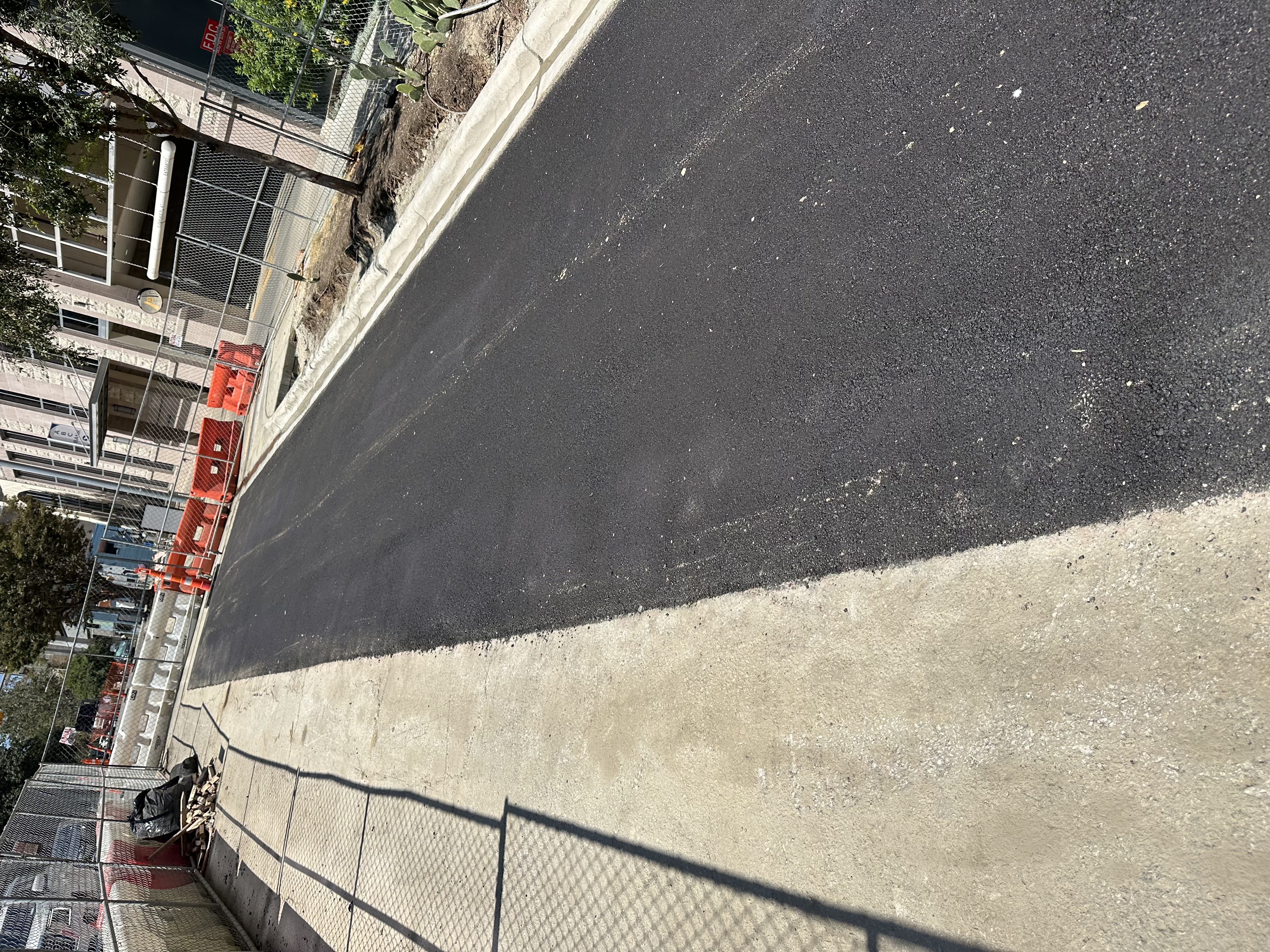 Roadway construction and curb repair site